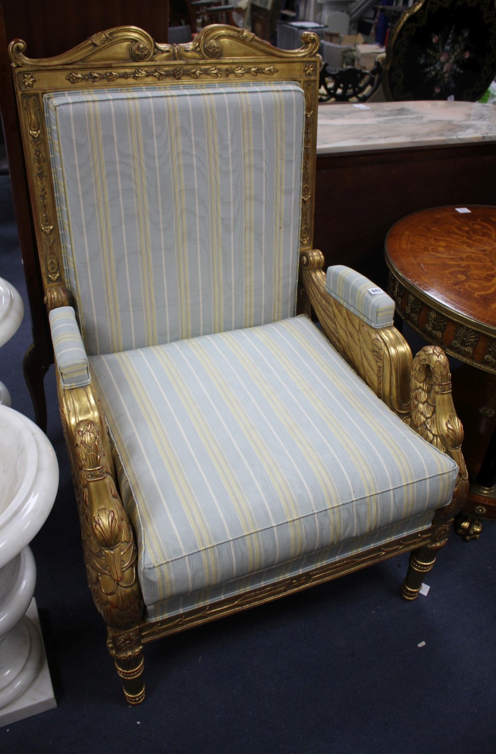A French Empire carved giltwood armchair, W.76cm D.76cm H.116cm